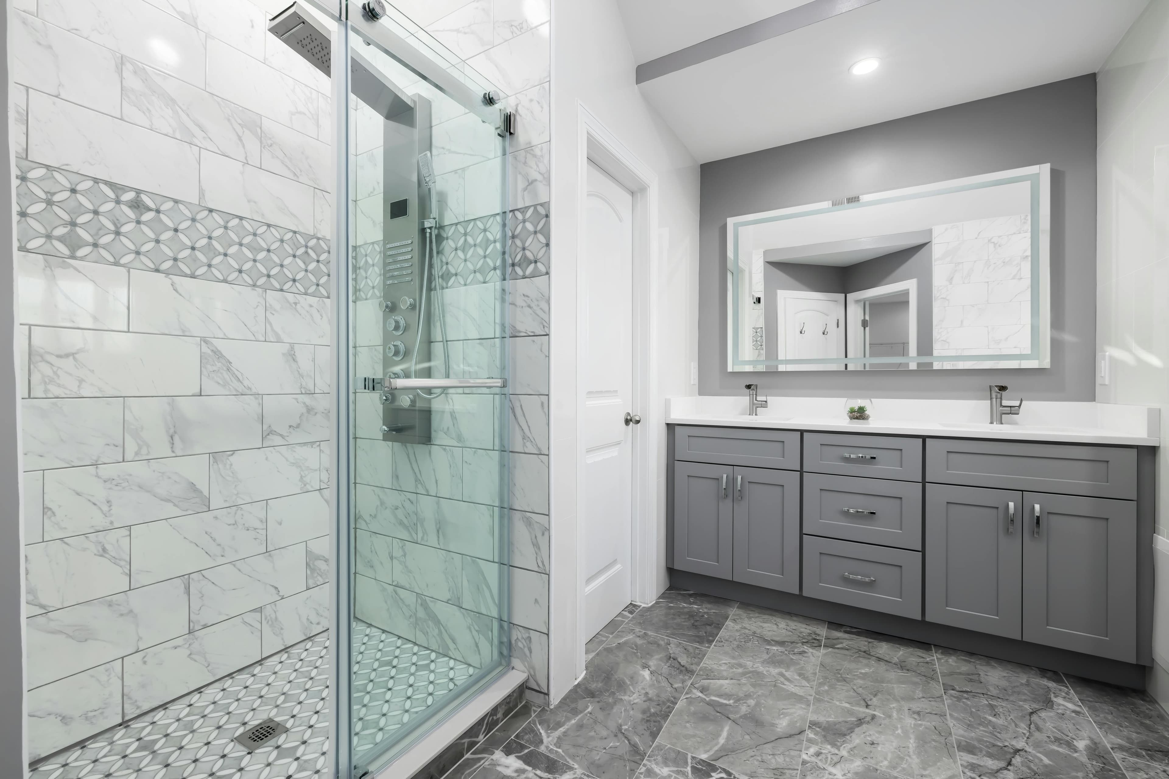Bathroom remodel with marble walk-in shower and double vanity in Lancaster, Ohio