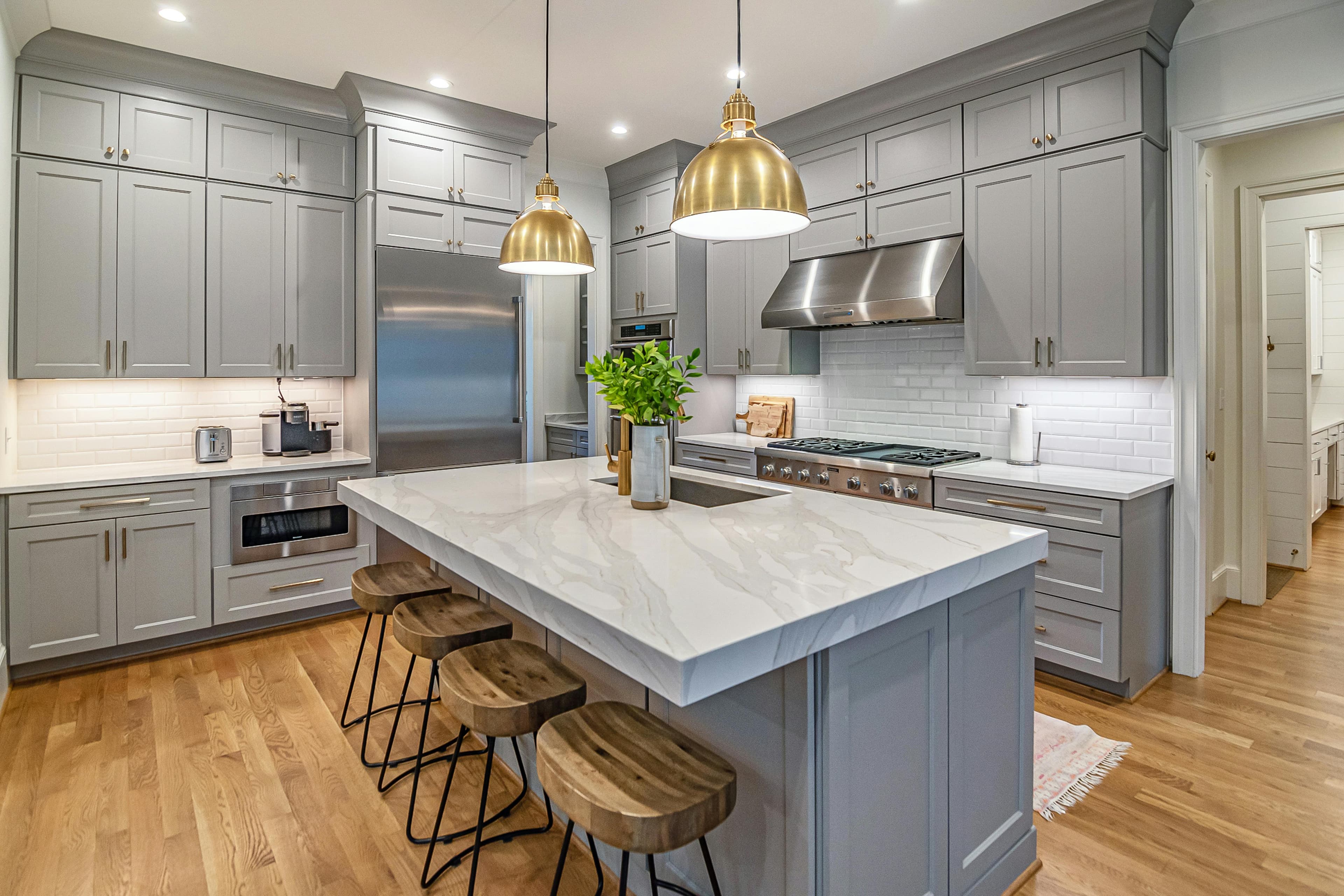 Modern kitchen remodel with gray shaker cabinets and marble island in Lancaster, Ohio